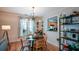 Stylish dining area with a round table, wood chairs, and modern chandelier lighting at 3332 Chastain Landings Ct, Marietta, GA 30066
