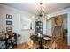 Cozy dining area featuring hardwood floors and modern lighting fixture at 3332 Chastain Landings Ct, Marietta, GA 30066