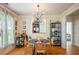 Cozy dining area featuring hardwood floors and modern lighting fixture at 3332 Chastain Landings Ct, Marietta, GA 30066