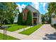 Charming brick two-story home with a well-manicured lawn and lovely landscaping at 3332 Chastain Landings Ct, Marietta, GA 30066