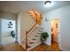 Inviting foyer with hardwood floors, a staircase, and access to powder room at 3332 Chastain Landings Ct, Marietta, GA 30066