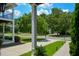 Green lawn, garden space, and trees define this home's exterior at 3332 Chastain Landings Ct, Marietta, GA 30066