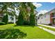 Beautifully landscaped lawn, trees, and garden space in front of this home at 3332 Chastain Landings Ct, Marietta, GA 30066