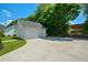 Detached two-car garage featuring a private driveway and mature trees adding extra shade and privacy at 3332 Chastain Landings Ct, Marietta, GA 30066