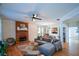 Comfortable living room with brick fireplace, dining area access and large sectional sofa at 3332 Chastain Landings Ct, Marietta, GA 30066