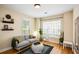 Comfortable living room with gray sofa, stylish decor, and ample natural light at 3332 Chastain Landings Ct, Marietta, GA 30066
