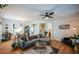 Inviting living room with hardwood floors, a sectional sofa, and modern decor at 3332 Chastain Landings Ct, Marietta, GA 30066
