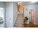 Classic staircase featuring carpeted steps and a wooden handrail, leading upstairs at 3332 Chastain Landings Ct, Marietta, GA 30066