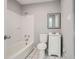 A full bath with a shower-tub combination, white vanity and black and white tile flooring at 5093 Ravenwood Dr, Marietta, GA 30066