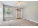 Bedroom featuring neutral carpet, a closet, and a window for natural light at 5093 Ravenwood Dr, Marietta, GA 30066