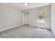 Neutral bedroom features carpet, a closet and natural light from the window at 5093 Ravenwood Dr, Marietta, GA 30066
