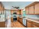 Well-lit kitchen featuring wooden cabinets, stainless steel appliances and durable countertops at 5093 Ravenwood Dr, Marietta, GA 30066