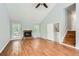Inviting living room showcasing hardwood floors, a stone fireplace, and a walkout to an outside deck at 5093 Ravenwood Dr, Marietta, GA 30066