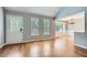 Bright living room featuring hardwood floors, a decorative front door, and ample natural light at 5093 Ravenwood Dr, Marietta, GA 30066