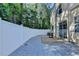 Private backyard featuring fenced in yard and large patio with a table at 609 Bedford Court, Woodstock, GA 30188