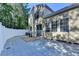 Private backyard featuring fenced in yard and large patio with a table at 609 Bedford Court, Woodstock, GA 30188