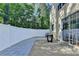Private backyard featuring fenced in yard and large patio with a table at 609 Bedford Court, Woodstock, GA 30188