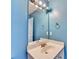 Bright bathroom with modern vanity and decorative lighting fixtures at 609 Bedford Court, Woodstock, GA 30188