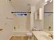 Clean bathroom features a shower-tub combo and a modern vanity at 609 Bedford Court, Woodstock, GA 30188