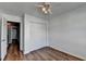 Bedroom featuring hardwood floors, a ceiling fan and double closet at 609 Bedford Court, Woodstock, GA 30188