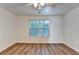Light and airy bedroom with wood floors and a ceiling fan at 609 Bedford Court, Woodstock, GA 30188