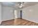 Spacious bedroom with hardwood floors and ceiling fan at 609 Bedford Court, Woodstock, GA 30188