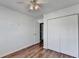 Bedroom featuring hardwood floors, a ceiling fan and double closet at 609 Bedford Court, Woodstock, GA 30188