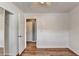 Bedroom with hardwood floors, closet with mirrored doors, and bright window at 609 Bedford Court, Woodstock, GA 30188