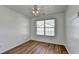 Bedroom featuring a window offering natural light, and wood laminate flooring at 609 Bedford Court, Woodstock, GA 30188