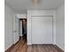 Bedroom featuring hardwood floors, a ceiling fan and double closet at 609 Bedford Court, Woodstock, GA 30188
