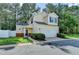 Charming two-story home with a two-car garage and well-maintained front lawn at 609 Bedford Court, Woodstock, GA 30188
