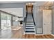Interior shot of open floorplan featuring staircase, hardwood floors and rear patio access at 609 Bedford Court, Woodstock, GA 30188