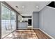 Living room with hardwood floors and sliding glass door, leading to the kitchen at 609 Bedford Court, Woodstock, GA 30188