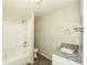 Bathroom with a shower-tub combo, modern vanity, and granite countertops at 1112 Smith St, Atlanta, GA 30310