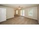 Large bedroom featuring carpet, neutral colors, ceiling fan, windows, and doors to a balcony at 1112 Smith St, Atlanta, GA 30310