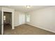 This is a roomy bedroom with a closet, neutral walls and plush carpeting at 1112 Smith St, Atlanta, GA 30310