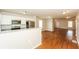 Modern kitchen with stainless steel appliances, white cabinets, and a breakfast bar overlooking the living area at 1112 Smith St, Atlanta, GA 30310