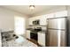 Updated kitchen with granite countertops, stainless steel appliances, and bright natural light at 1112 Smith St, Atlanta, GA 30310