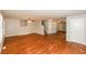 Spacious living room featuring gleaming hardwood floors, abundant natural light, and neutral paint at 1112 Smith St, Atlanta, GA 30310