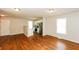 Open-concept living space showcasing hardwood floors and modern kitchen with stainless steel appliances at 1112 Smith St, Atlanta, GA 30310
