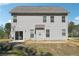 Back of house showing patio at 2860 Windsor Knoll Dr, Dacula, GA 30019