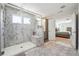 Bright and spacious primary bath with walk-in shower, and vanity with lots of storage at 2860 Windsor Knoll Dr, Dacula, GA 30019