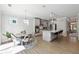 Bright, open-concept kitchen with stainless steel appliances, an island, and a breakfast area at 2860 Windsor Knoll Dr, Dacula, GA 30019