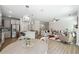 Bright open-concept living area with a modern kitchen, dining space, and comfortable seating area at 2860 Windsor Knoll Dr, Dacula, GA 30019