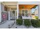 Inviting front porch with a swing, stone accents, and a charming, decorative entrance at 2860 Windsor Knoll Dr, Dacula, GA 30019