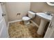 Functional half-bathroom with a pedestal sink and neutral fixtures at 378 Durmire Dr, Jonesboro, GA 30236
