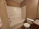 Bathroom featuring a white tub and shower with a neutral color palette at 378 Durmire Dr, Jonesboro, GA 30236