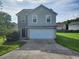 Charming two-story home featuring a two-car garage, stone accents, and a well-manicured lawn at 378 Durmire Dr, Jonesboro, GA 30236