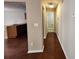 Hallway leading to the kitchen featuring hardwood floors and neutral paint colors at 378 Durmire Dr, Jonesboro, GA 30236
