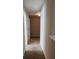 Hallway with neutral walls and floors leading to rooms in the home at 378 Durmire Dr, Jonesboro, GA 30236